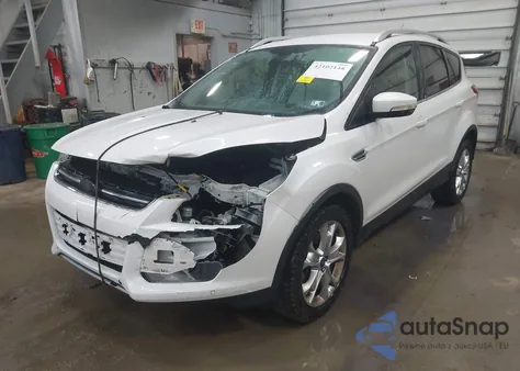 2014 Ford Escape Titanium z USA, uszkodzony, nr VIN 1FMCU9J90EUD21552